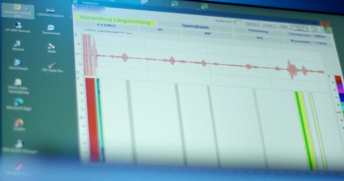 Digital interface displaying red waveform and multicolored bar chart on computer screen for technical measurement data