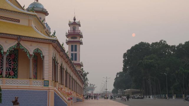 Temple corridor perspective leading to tower static shot Tay Ninh Vietnam architecture scene