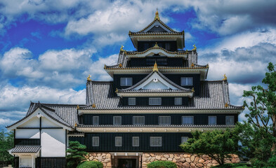 Fototapeta premium Okayama Castle, known as the crows castle because of its black walls, often compared with Himejis white egret.