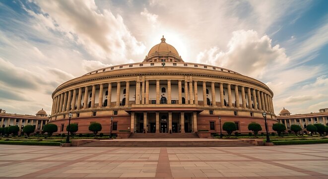 The indian parliament house in new delhi with a cloudy sky background