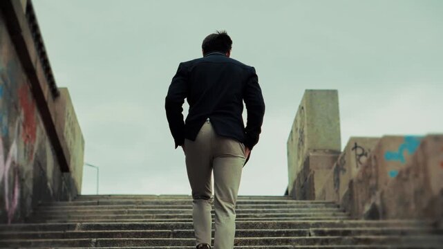 Businessman Climbing Stone Stairs. Manager Moving Forward To Achievement