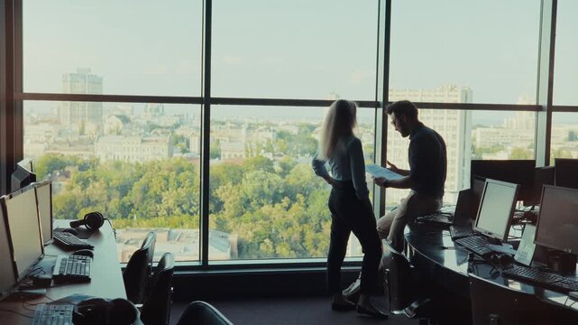 Professional Team Analyzing Reports During Corporate Meeting. Coworkers Collaborating On Business Strategy