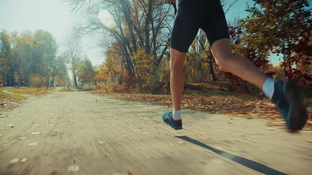 Athlete Training For Marathon During Sunny Day. Fitness Workout And Healthy Lifestyle