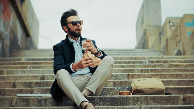 Manager Eating Fast Food And Drinking Coffee On City Steps. Quick Snack During Workday