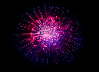 Fototapeta premium Fireworks: A vibrant display of colorful fireworks explodes against a dark background, creating a mesmerizing spectacle of light, color, and celebration.