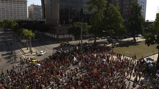 Drone Footage, Aerial View, crowd of People walking and partying in carnival block party in the Brazilian carnival of Rio de Janeiro
