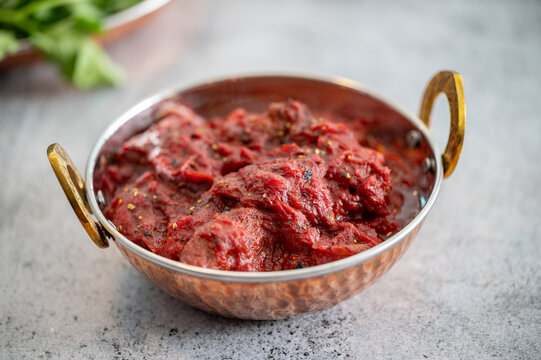 Traditional Indian vag and chicken curry served with naan flat bread. Indian curry, chicken tikka masala with rice and naan bread. Dark background. Copy space.