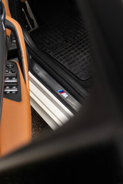 BMW 530i m sport door sill plate close up, Luxury sedan interior entrance detail with trim level logo