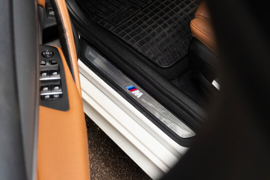 BMW 530i m sport door sill plate close up, Luxury sedan interior entrance detail with trim level logo