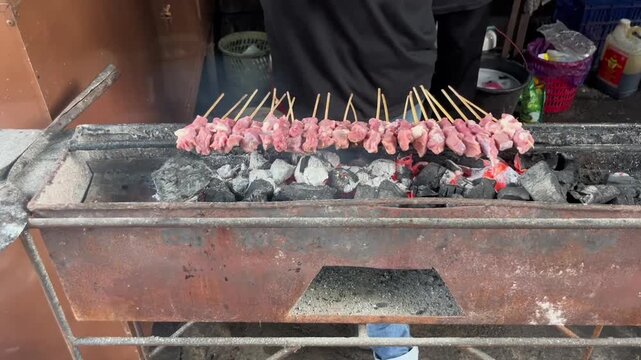 Indonesian food, Lamb satay on the charcoal grill in traditional market