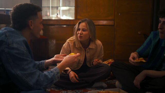 Man Shares Pizza With Woman. Cozy Evening With Playful Pizza Sharing Among Close Friends