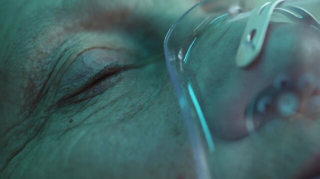 Woman with oxygen mask waking up after coma or surgery