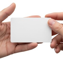 Fototapeta premium Hands holding a blank business card against a plain background