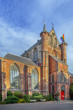Facade of Pieterskerk church in Leiden, Netherlands. Gothic architecture of the historical monument under cloudy sky