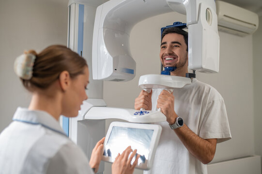 Patient undergoing panoramic dental x-ray scan
