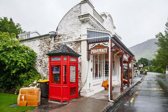 Pharmacy storefront and red telephone booth in Arrowtown