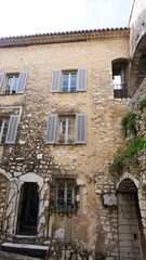 Fototapeta premium Traditional old stone houses on a street in the medieval town of Saint Paul de Vence, French Riviera, South of France