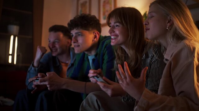 Group Of Friends Passionately Cheer While Playing Video Games With Snacks And Controllers