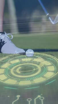 Vertical video: Golfer placing foot and starting swing blue club hitting ball as golf HUD guiding
