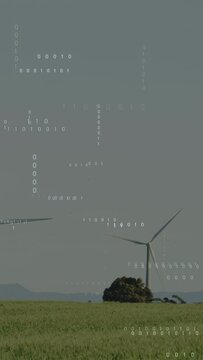 Vertical video: Wind picking up center turbine rotating while binary streams shifting to show power
