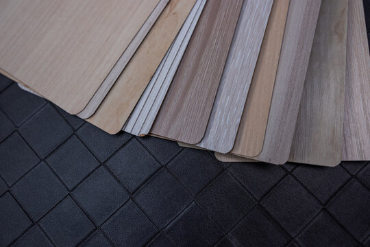 Decorative Wooden Panel Samples on Grey Tile Background for Professional House Interior Design