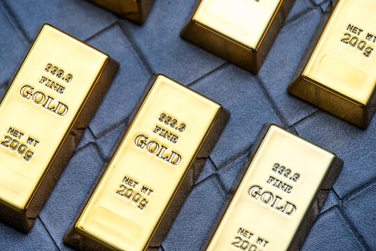 Rows of Shiny Gold Bullion Bars on Dark Background for Financial Reserve and Wealth Investment