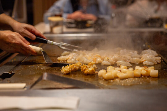 Hibachi chef cooking seafood