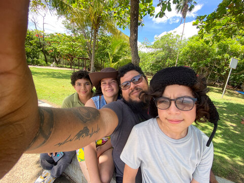 Family enjoying summer vacation selfie in tropical costa rica