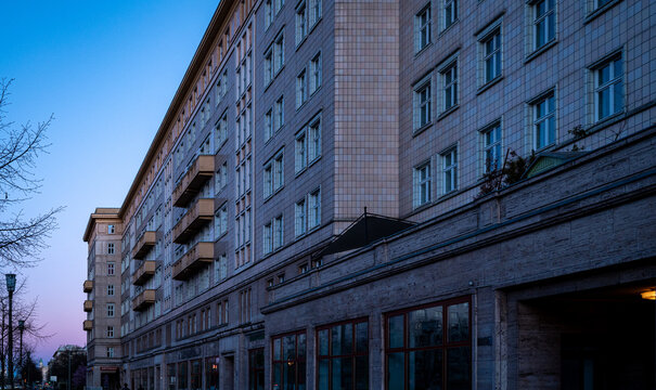 Residential block on Karl‑Marx‑Allee in evening light, Berlin