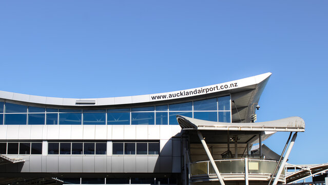 Auckland, NZ - March 4. 2026: The exterior of the terminal building at Auckland Airport in New Zealand isolated against a blue sky. Editorial Use Only.