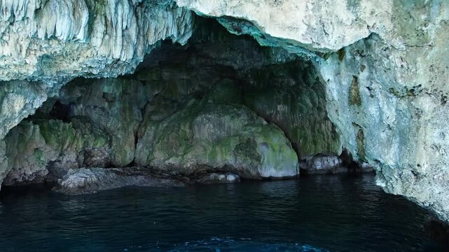 Turkiye, Belek, 27.07.2025 Sea cave in Turkey with limestone cliff walls. Boat trip exploring natural coastal grotto. Summer holiday adventure in Mediterranean marine cavern site landscape.