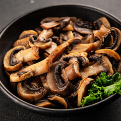 Fototapeta premium Champignon mushrooms ready to eat tasty snack fresh gourmet food background on the table rustic food top view copy space keto and paleo diet vegetarian and vegan food marketing concept photo