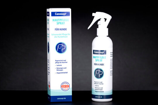 Canosept skin care spray for dogs with bottle and packaging box on dark background. Pet hygiene and dermatological care product shown as illustrative editorial content.