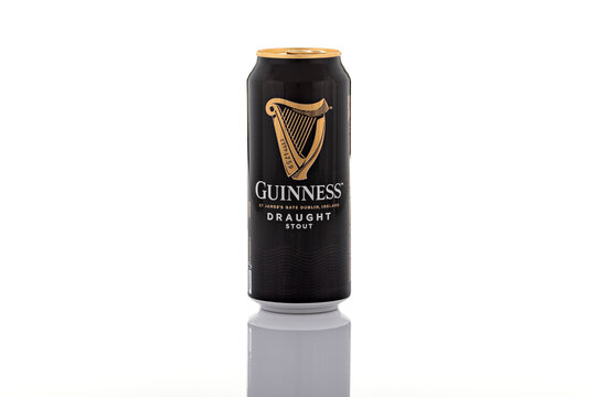 Guinness Draught stout beer can photographed isolated on white background. Irish stout beer packaging shown as illustrative editorial content.
