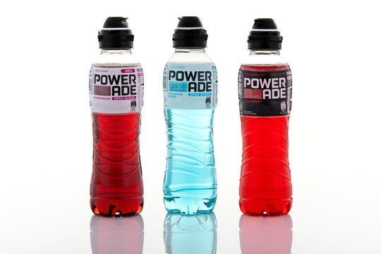 Assorted Powerade sports drink bottles including Zero Sugar and flavored variants isolated on white background. Hydration beverage packaging shown as illustrative editorial.