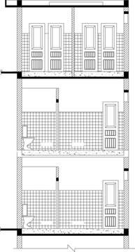 Technical architectural drawing of bathroom sections showing toilet stalls, tiled walls, partitions, and louvered doors in blueprint style.