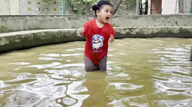 A little girl expressing during mud bath