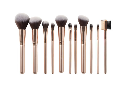 A set of rose gold makeup brushes with dark brown bristles isolated on transparent background