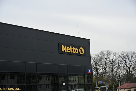 Netto Store Facade with Logo Signage on Retail Building
