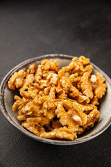 Fototapeta premium Walnut kernels peeled dried walnuts tasty snack fresh delicious gourmet food background on the table rustic food top view copy space keto and paleo diet vegetarian and vegan food