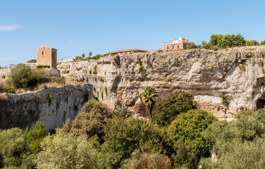 Fototapeta premium The Latomia del Paradiso inside the Neapolis Archaeological Park in Syracuse, Sicily, Italy. Historic archaeological site connected to Greek and Roman history.