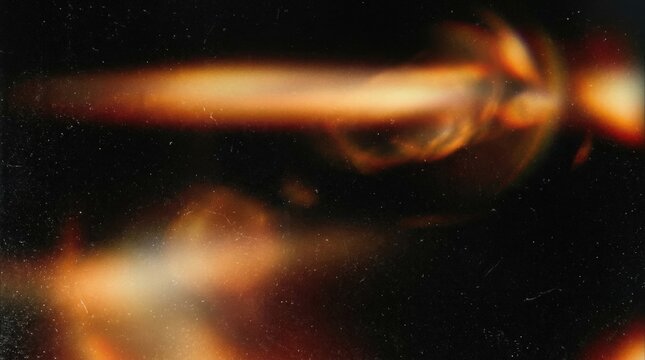 A warm blurred light leak overlay on a black background, retro noisy film flare and subtle analog burn glow with cinematic softness, ultra-realistic, no logos.