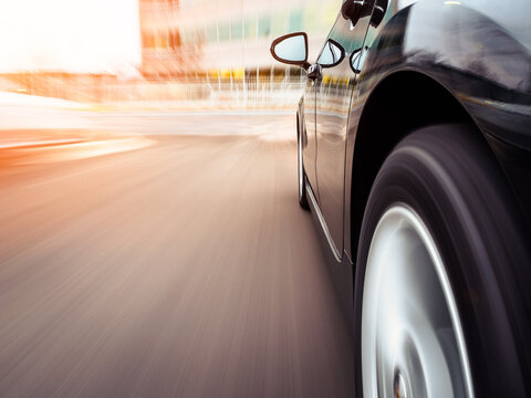 Side view of a Car speeding towards a city, Illinois, USA