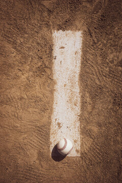 Baseball on pitcher's mound and infield dirt