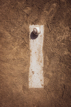 Baseball on pitcher's mound and infield dirt