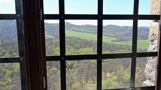 View from a barred window of Holloko Castle.