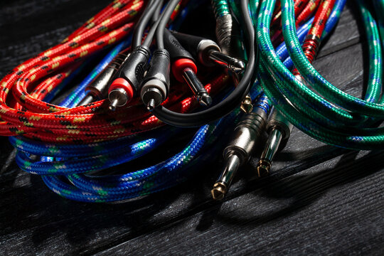 rca ts audio cable on black wood background