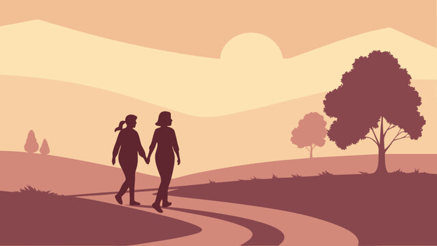Couple walking hand in hand along a scenic countryside path at sunset