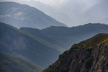 Fototapeta premium Layers of mountains creating a hazy atmospheric perspective