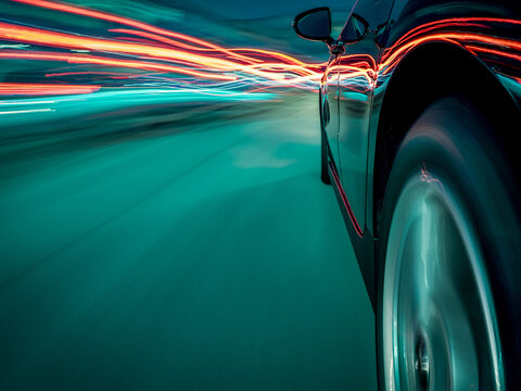 Side view of a Car driving through traffic at speed with light trails